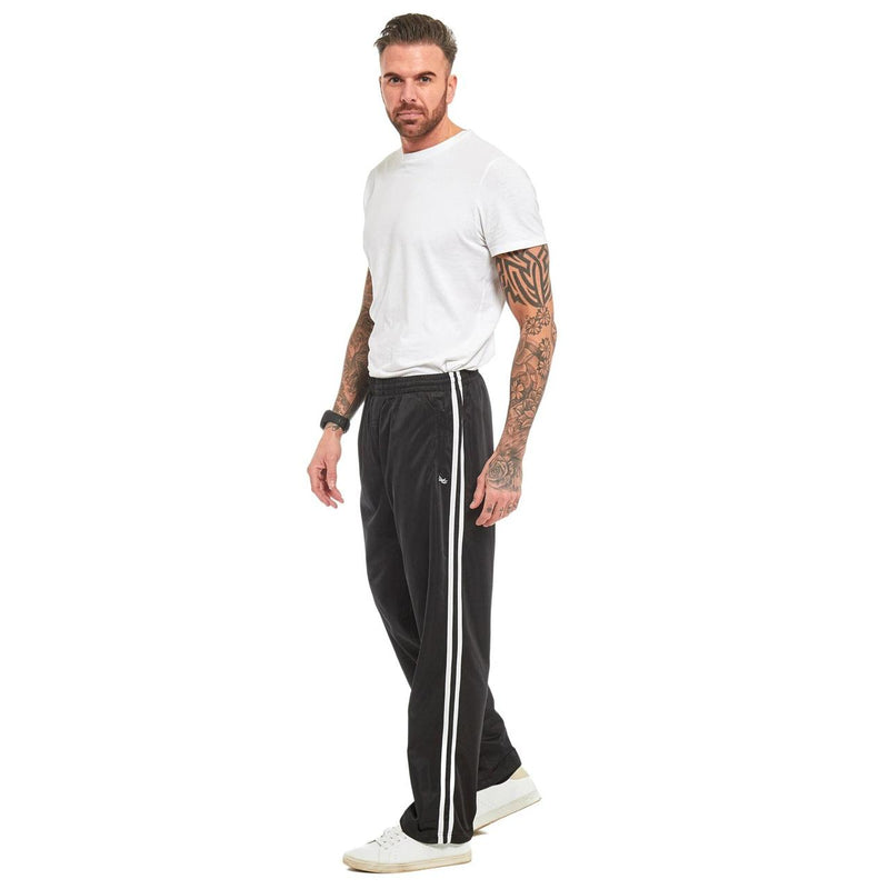 Man wearing black jogging bottoms with twin white side stripes and open hems